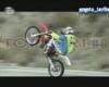 Motorbike jump over a moving truck.